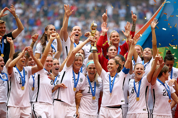 VANCOUVER, BC - JULY 05: Abby Wambach #20 and Christie Rampone #3 of the United States of America hold the World Cup Trophy after their 5-2 win over Japan in the FIFA Women's World Cup Canada 2015 Final at BC Place Stadium on July 5, 2015 in Vancouver, Canada. (Photo by Ronald Martinez/Getty Images)